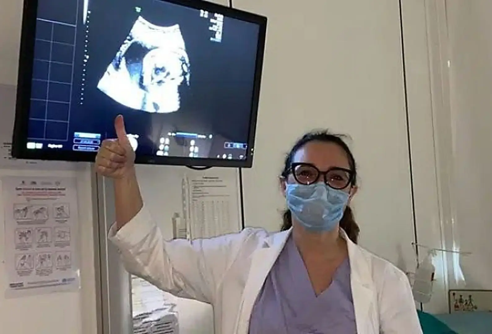 Doctor pointing at an ultrasound image on a screen, ABC Burlo